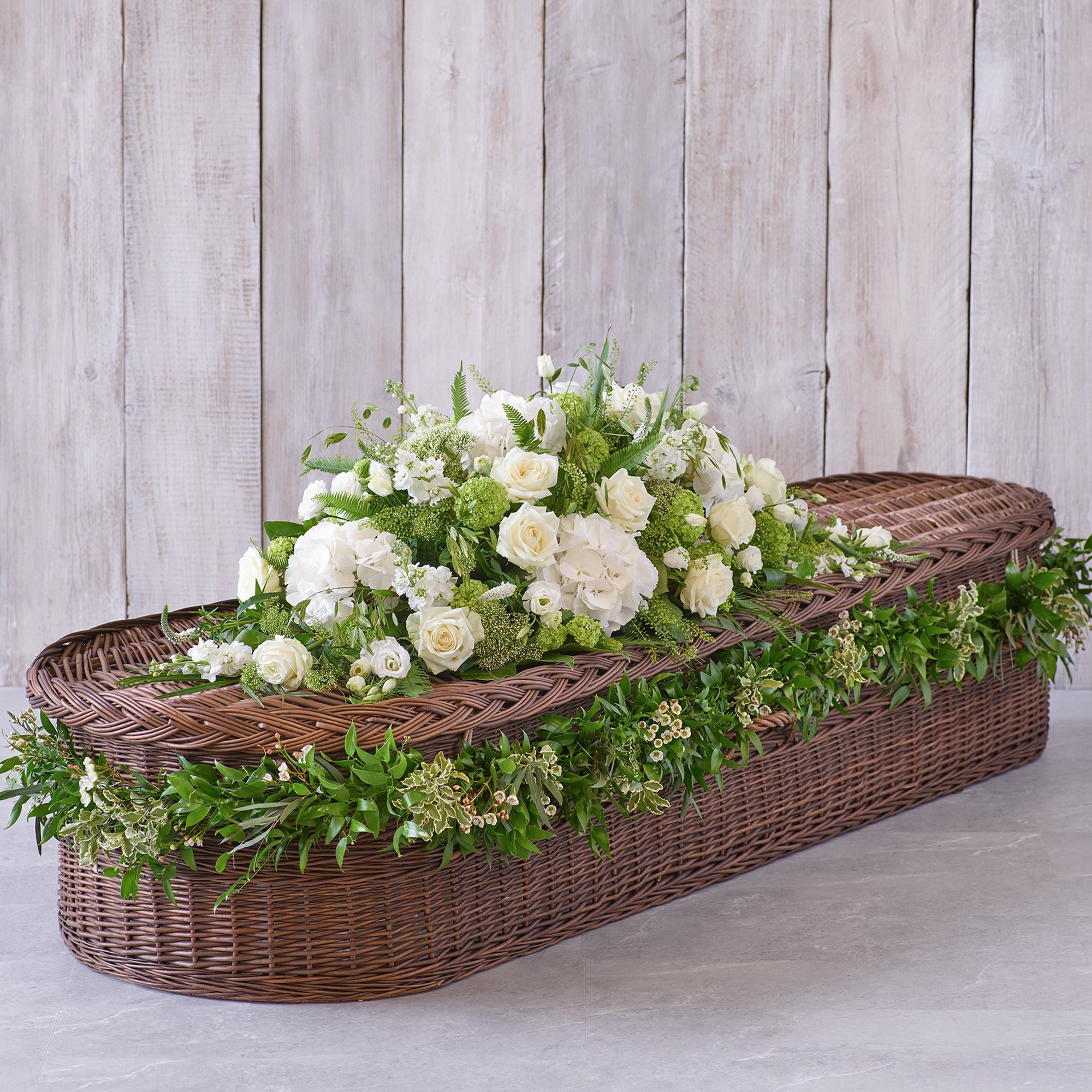 Click to view product details and reviews for Large White Casket Spray With Garland.