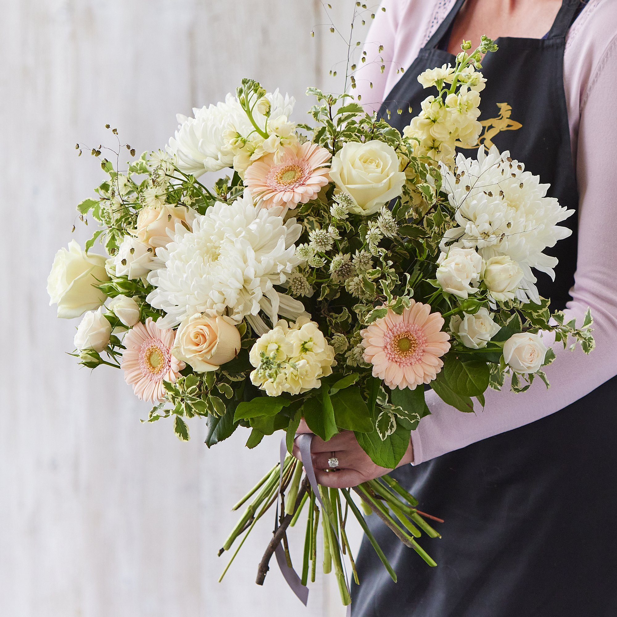 Sympathy hand-tied made with the finest flowers image