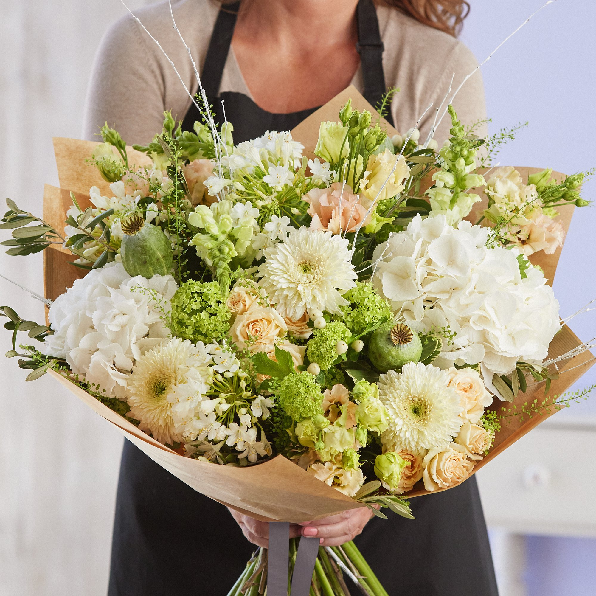 Sympathy hand-tied made with the finest flowers image
