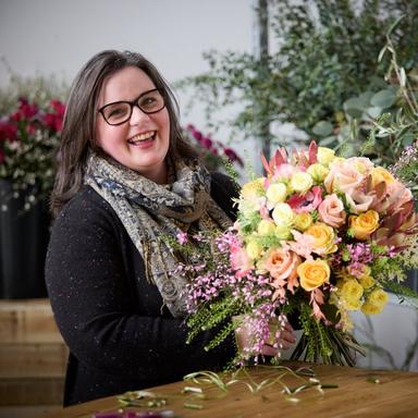 Interflora-florist-with-bright-pastel-bouquet