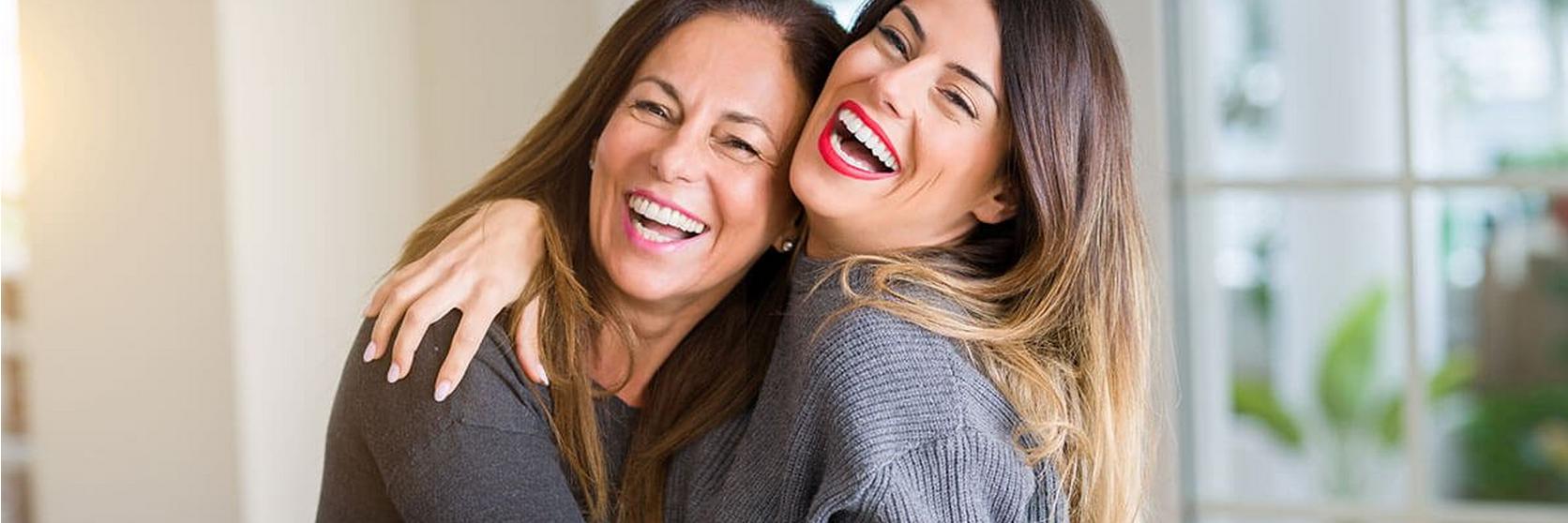 Mother-And-Daughter-Hugging-Lauging