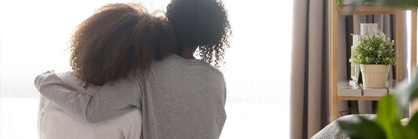 Mother-and-Daughter-Hugging-in-bed