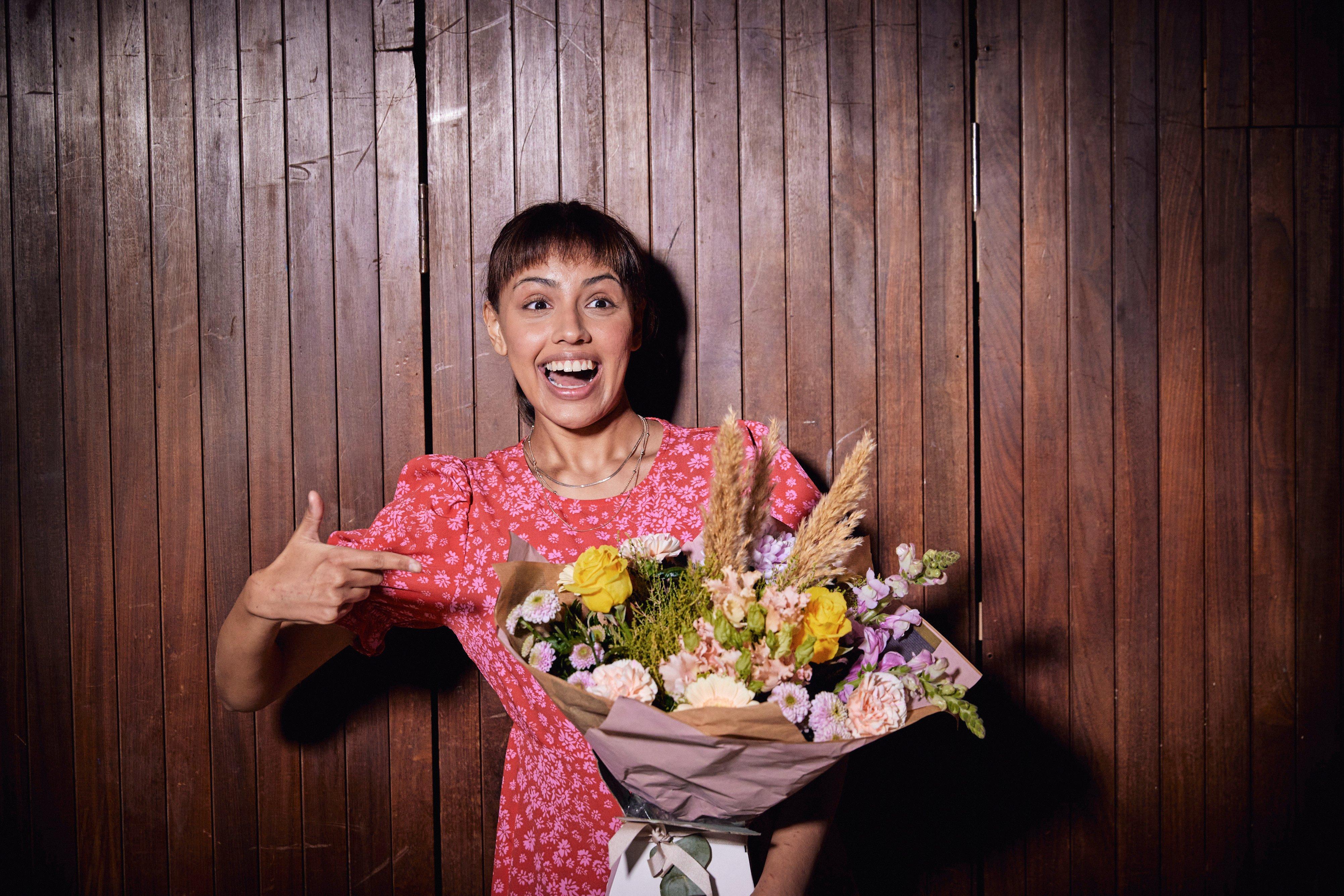 Women pointing at flowers