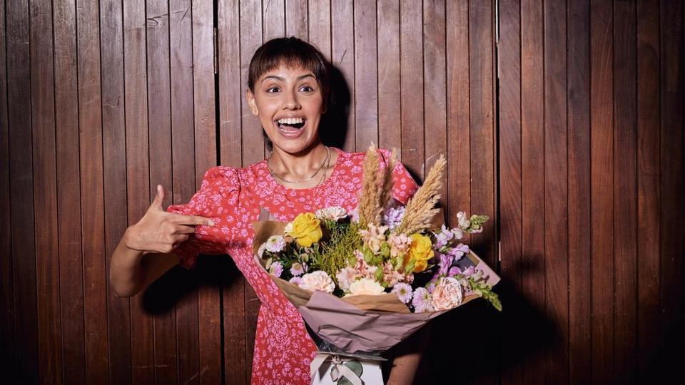 Women pointing at flowers