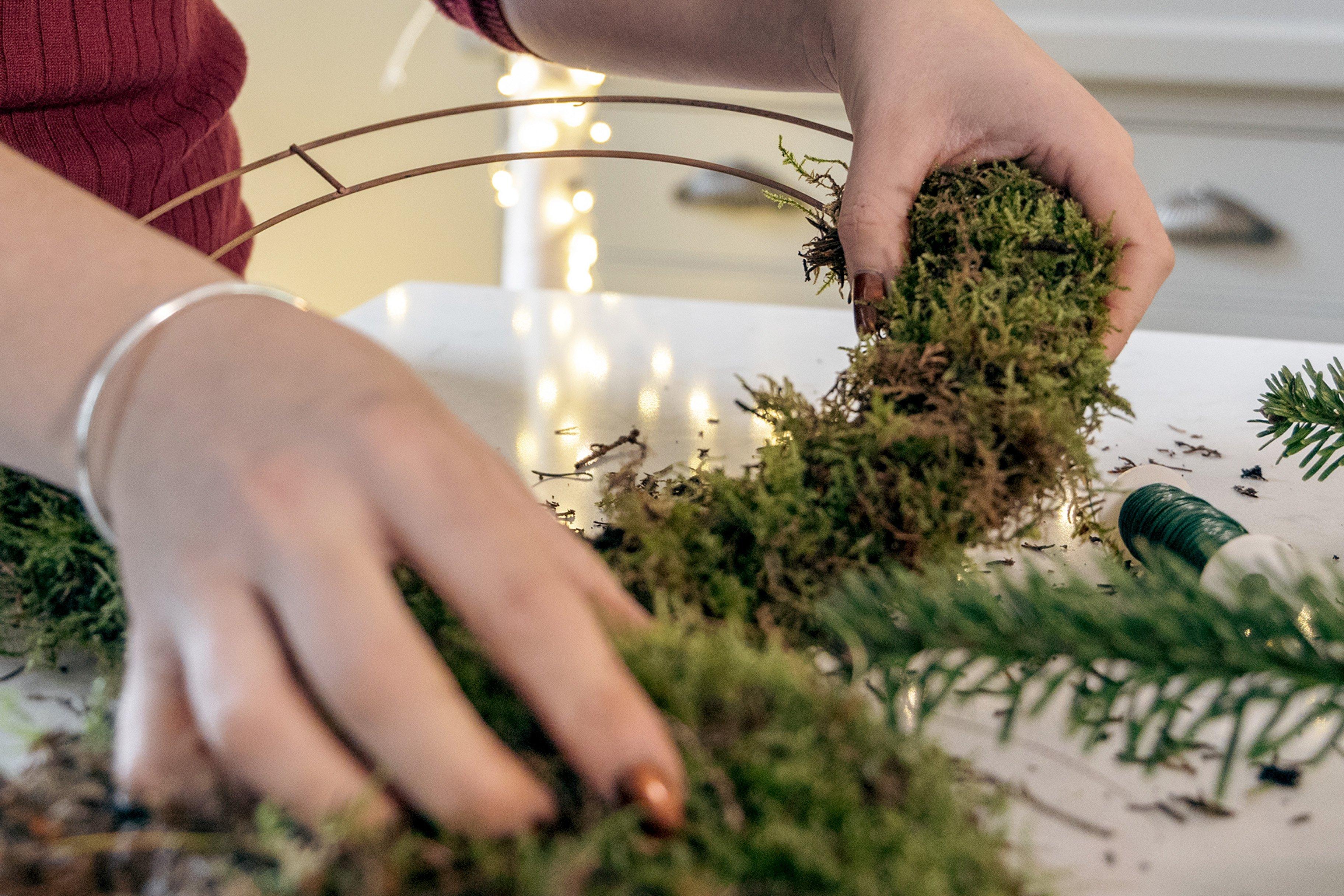 adding_moss_to_wire_wreath