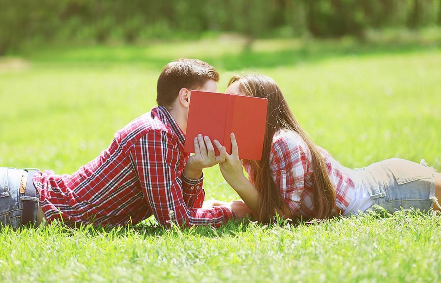 couple-reading-book-outdoors