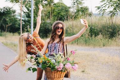 friends-taking-selfie-on-bike-flower-basket