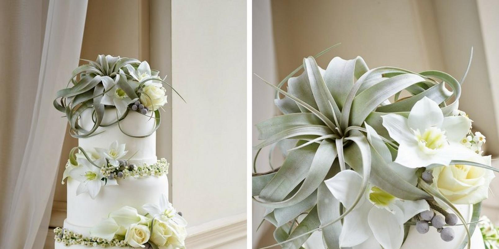 white-wedding-cake-with-white-floral-decorations