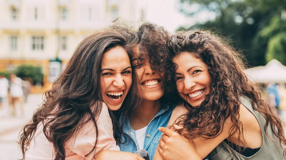 woman-laughing-hugging